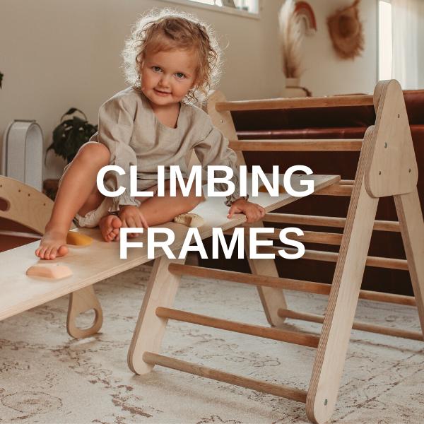 image of a child on a pikler triangle climbing frame and text overlay of 'climbing frame'