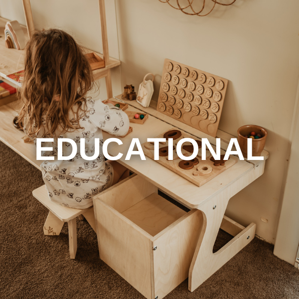 this is an image of a small child at a desk with educational toys and resources