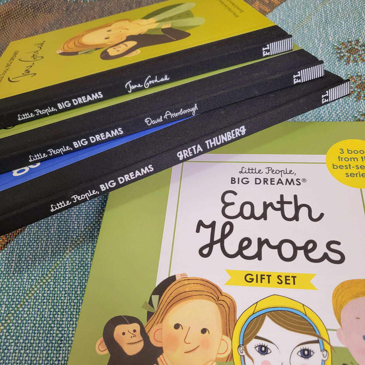 alternate angled image of children's gift set called Little People Big Dreams, Earth Heroes. There are 3 books, each called Greta Thunberg, David Attenborough and Jane Goodall.